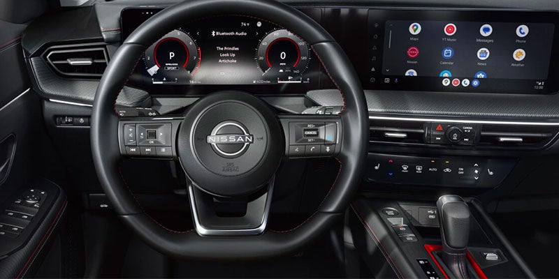 Nissan car interior with steering wheel and digital dashboard