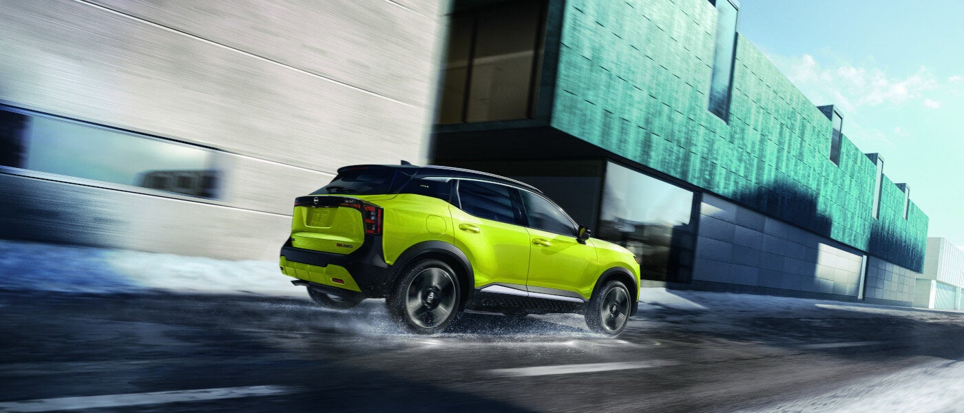 2026 Nissan Kicks driving on snowy road