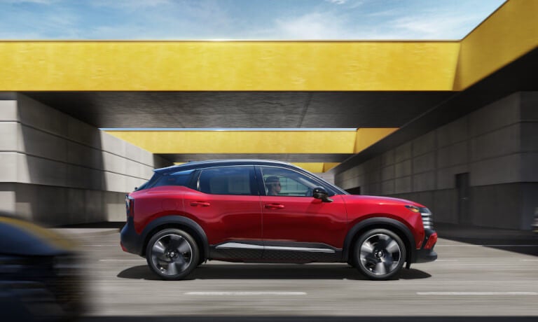 2026 Nissan Kicks side view driving underpass